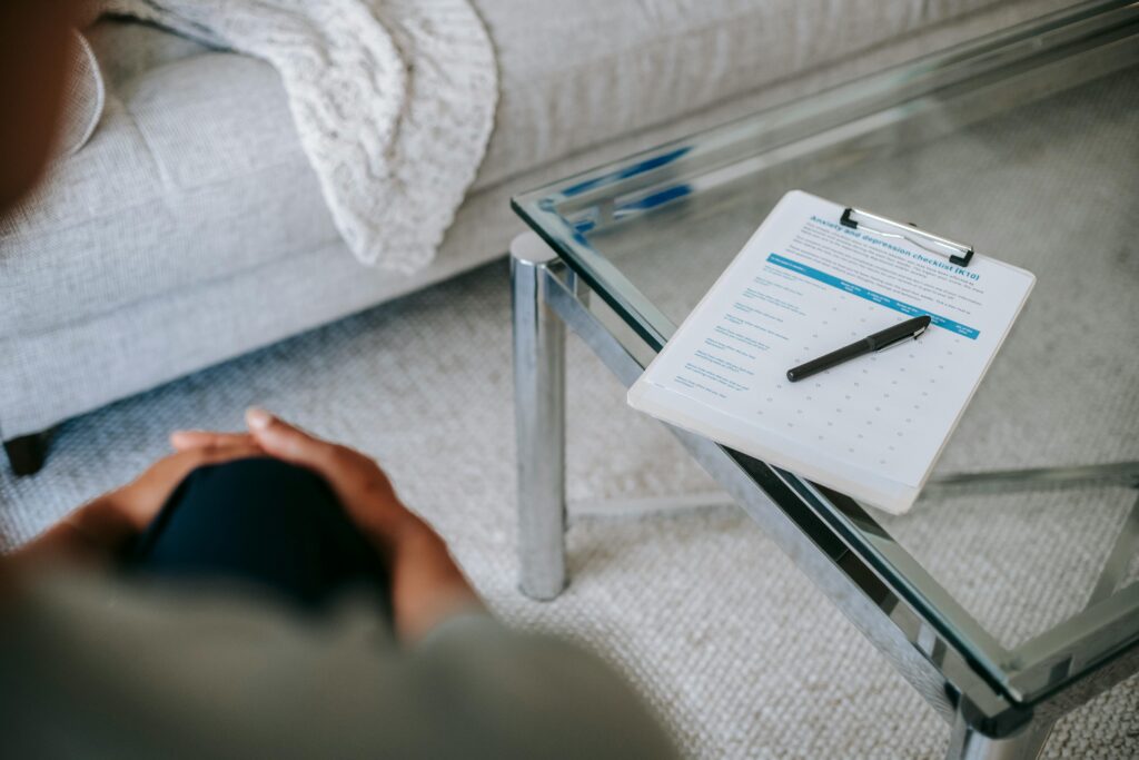 Pen and paper representing someone taking notes in an individual counselling session